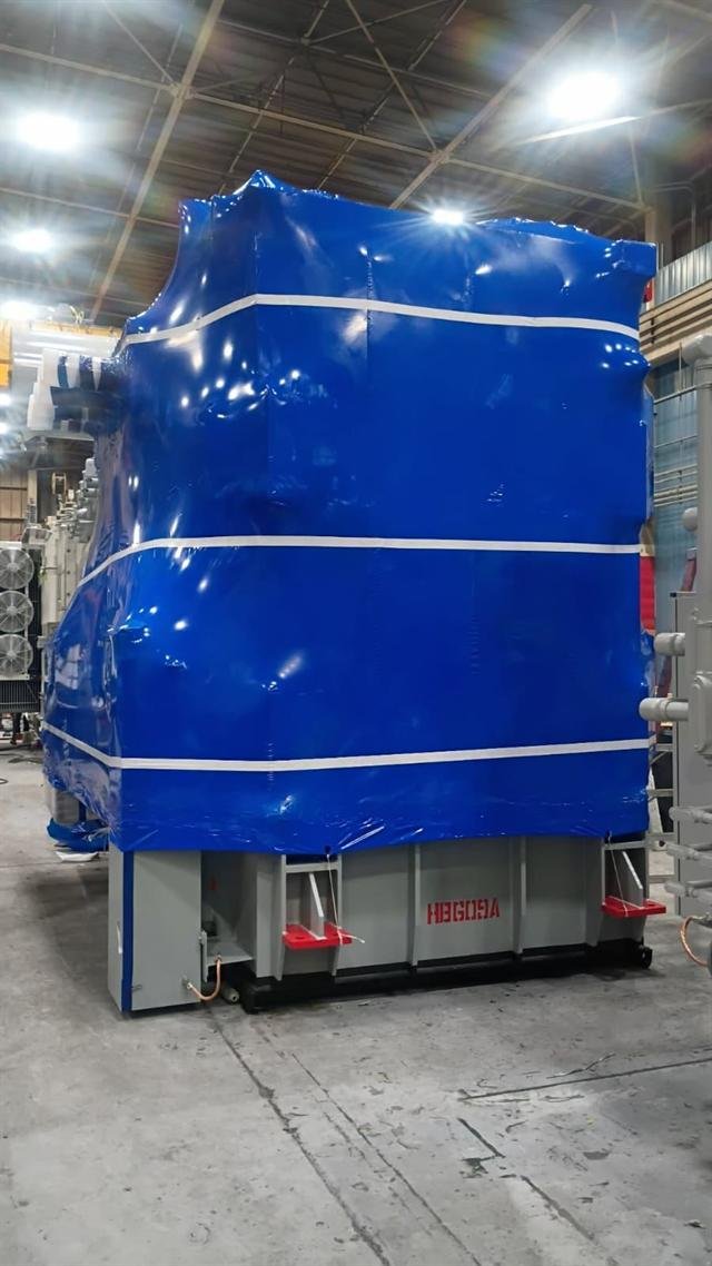 Power transformer fully sealed in blue shrink wrap with white reinforcement banding